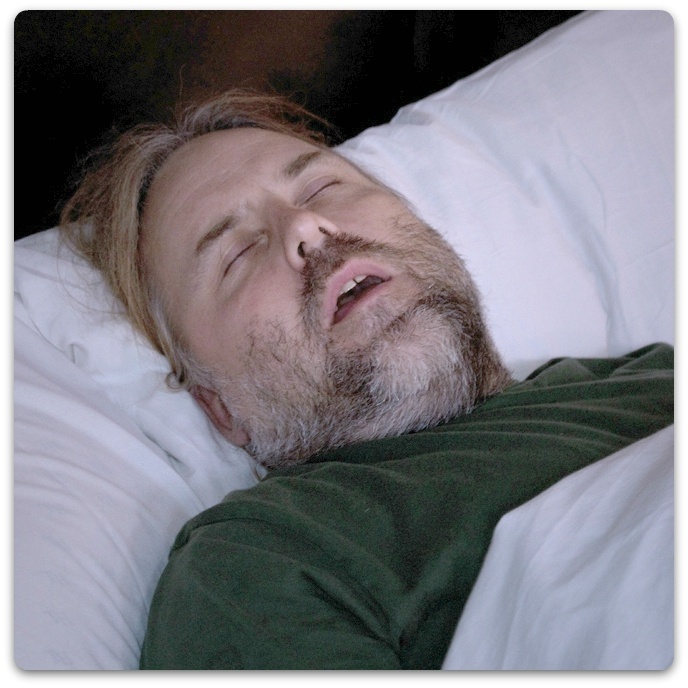Man with sleep apnea snoring